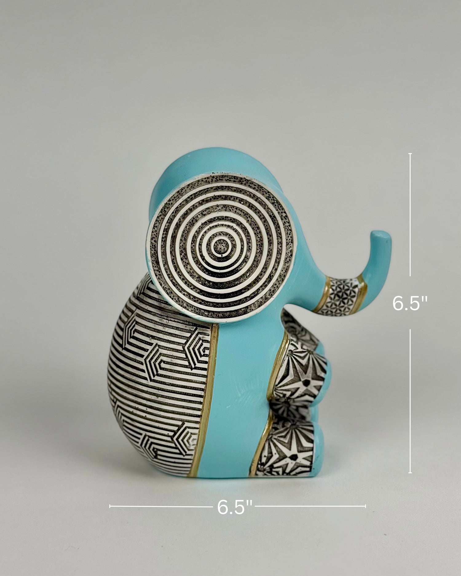 High Objects small blue polyresin elephant figurine with black and white geometric patterns and gold accents.