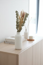 High Objects Botanical Eucalyptus Harvest dried flower arrangement with eucalyptus, pampas grass, bunny tails, and grain stems in a white vase.