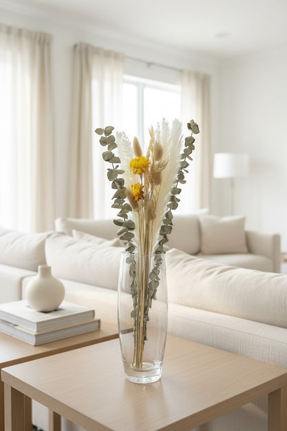 High Objects Botanical Golden Whisper dried flower arrangement with pampas grass, eucalyptus, and golden strawflowers in a glass vase.