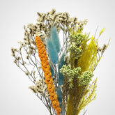 High Objects Botanical Sunlit Meadow dried flower arrangement with yellow, teal, orange, and cream blooms and grasses.