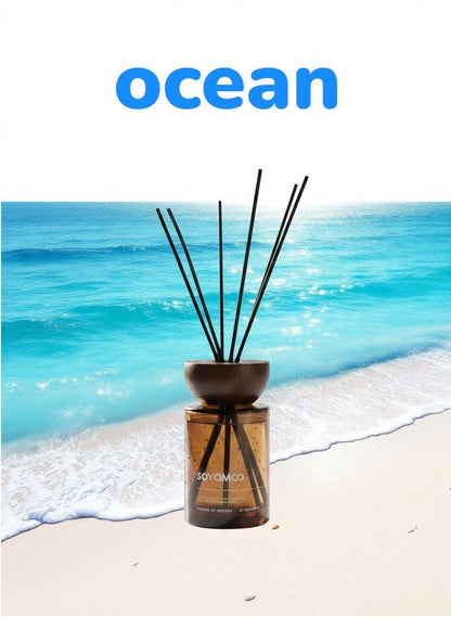 High Objects compact brown glass reed diffuser with oriental wood scent, 110ml, on a marble countertop.