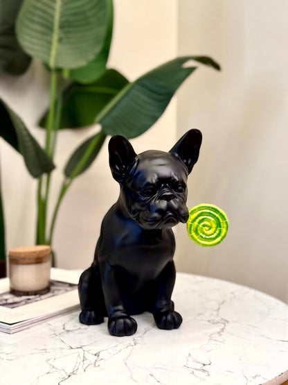 High Objects matte black French bulldog showpiece holding a green lollipop, modern décor.