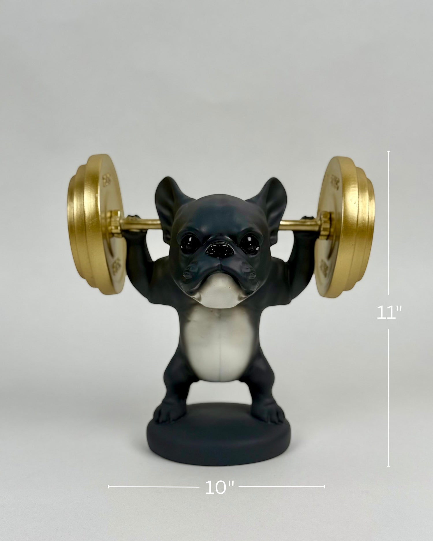 High Objects matte black French bulldog figurine lifting gold barbell, 11" H x 10" W, polyresin weightlifting showpiece.