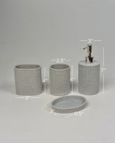 High Objects Calmridge Bathroom Accessory Set: speckled grey resin soap dispenser, toothbrush holder, tumbler, and soap dish with ribbed texture.