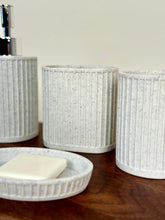 High Objects Calmridge Bathroom Accessory Set: Speckled white ceramic soap dish with soap, dispenser, and tumbler with ribbed texture.