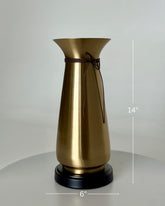 High Objects Celestia Vase, a 14-inch tall gold tapered vase with a flared rim, cord detail, and black base.
