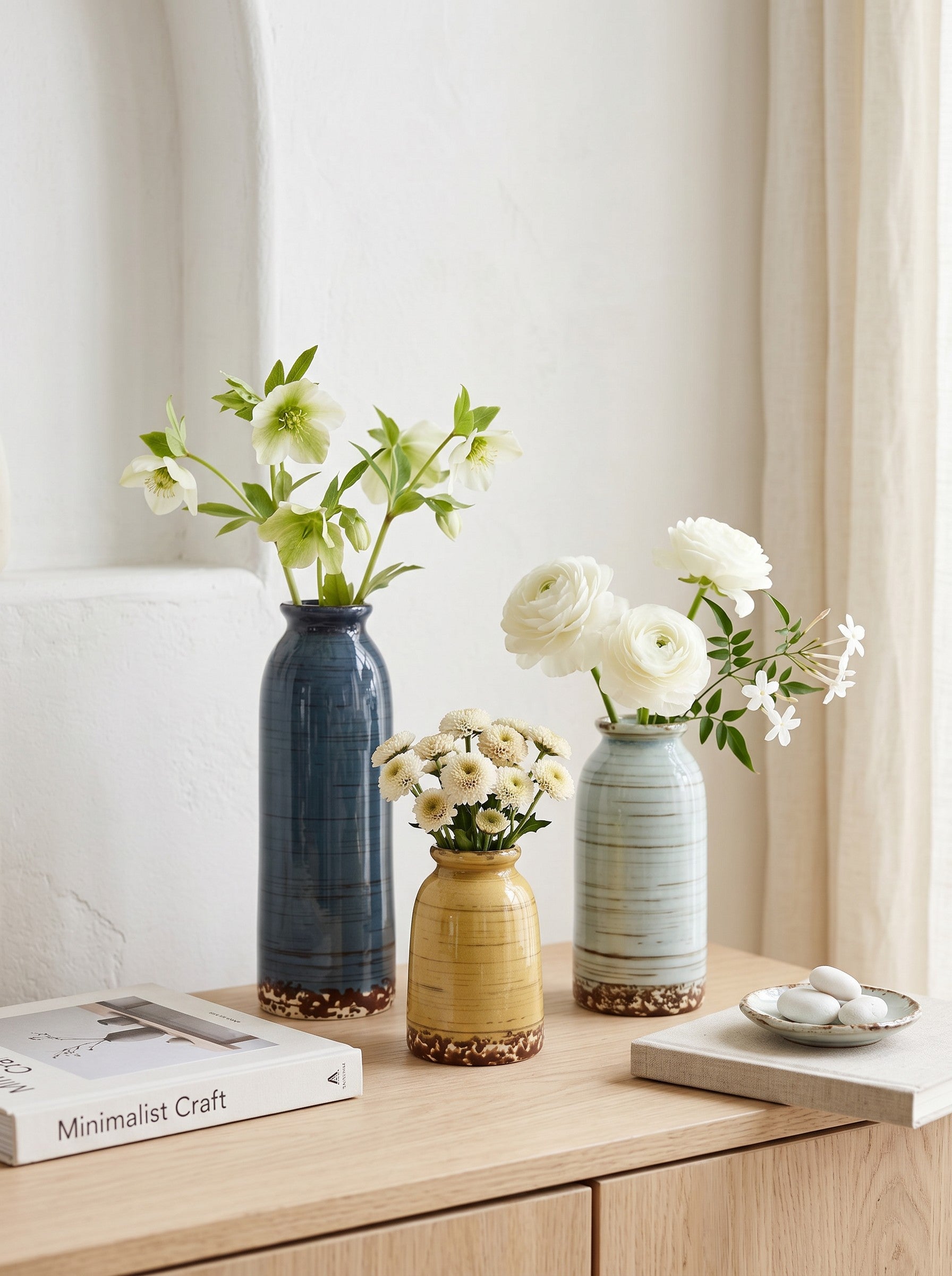 High Objects set of 3 ceramic vases in blue, yellow, and light blue with textured horizontal lines and brown speckled bases.