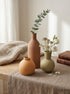 High Objects set of 3 ceramic vases in terracotta, sage green, and orange. Round and bottle shapes.