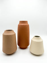 High Objects set of 3 ceramic vases in beige, brown, and cream with textured diagonal lines.