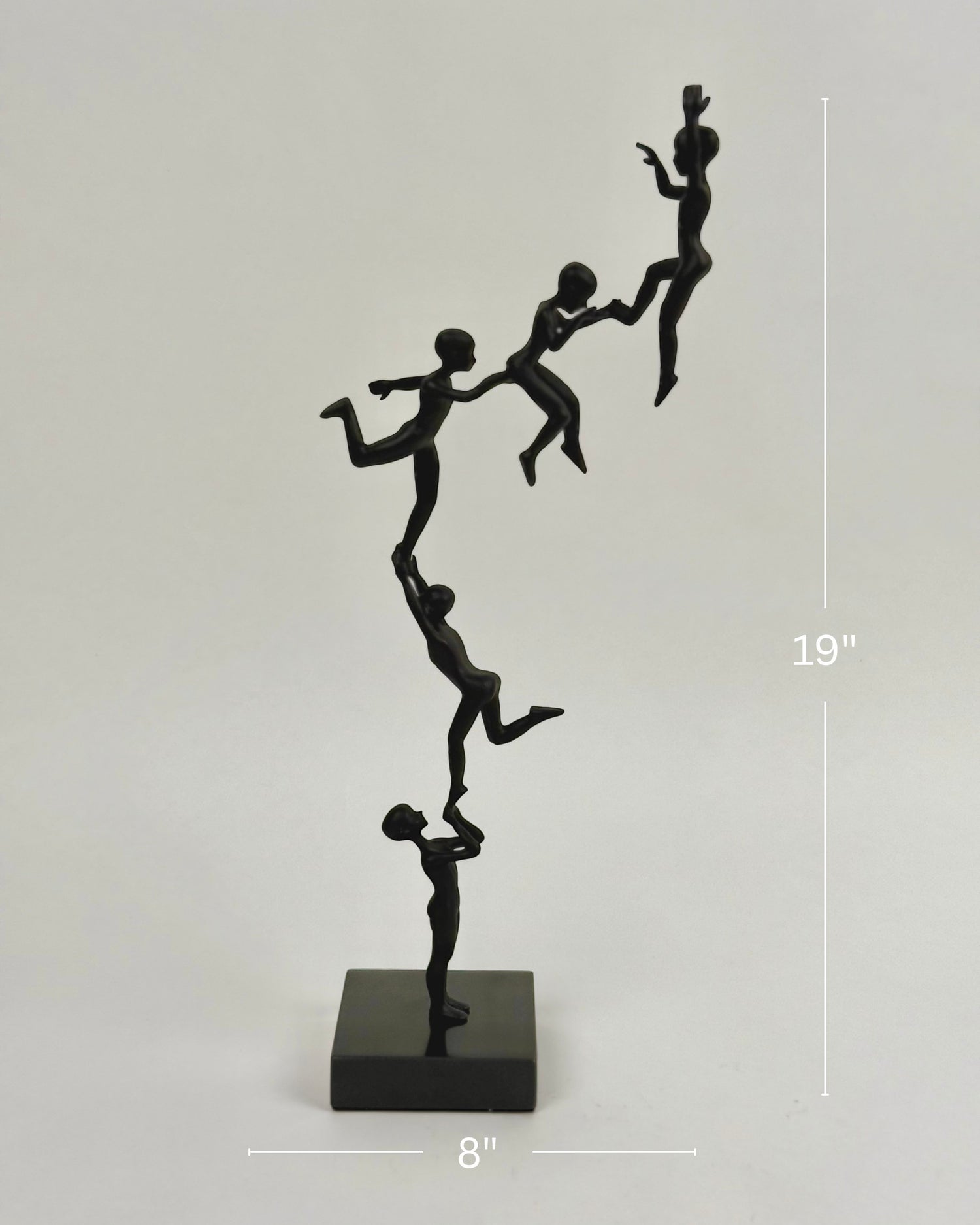 High Objects Climber Crew Artefact sculpture, matte black finish, 19 inches tall, depicting figures in a chain lifting each other.