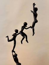 High Objects Climber Crew Artefact sculpture in matte black finish, depicting figures supporting each other upwards. 19-inch.