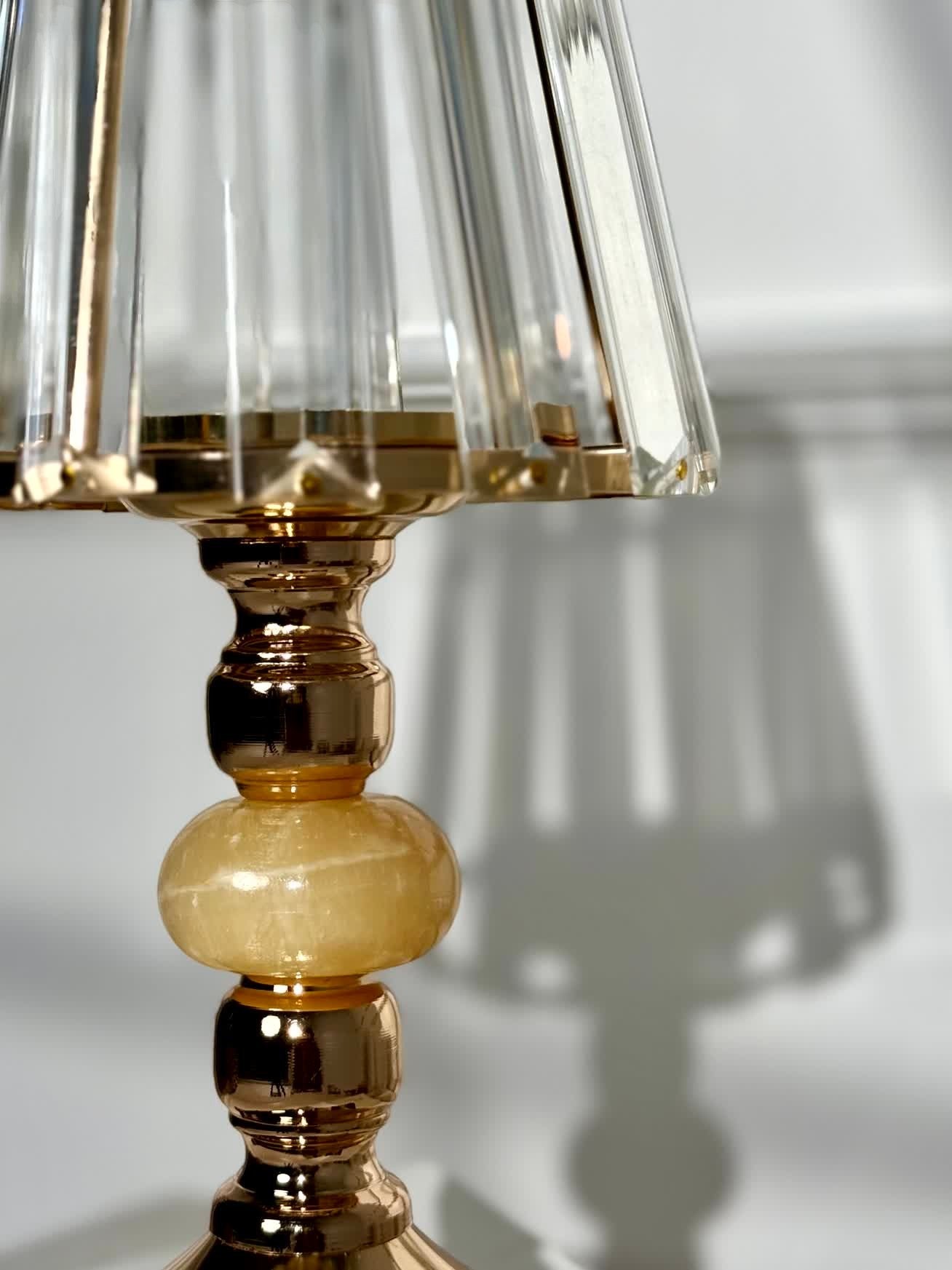 High Objects Crystal Belle candle stand with faceted glass shade and gold pedestal stem with amber stone accent.