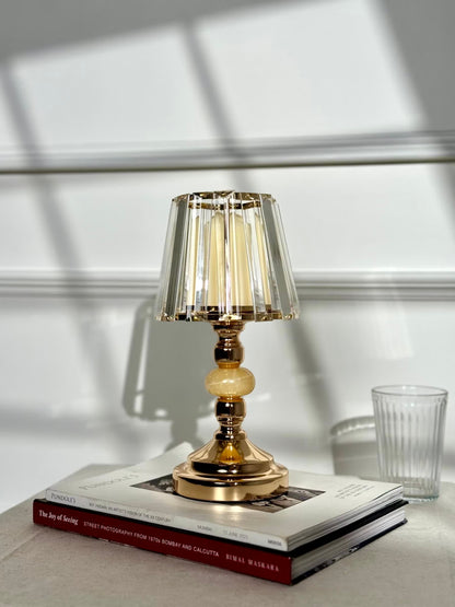 High Objects Crystal Belle candle stand with faceted glass shade and gold pedestal stem, holding a cream candle.