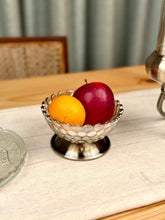 High Objects Crystal Bloom Accent Bowl with scalloped rim and metallic base, holding an apple and an orange.