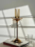 High Objects Crystal Bloom candle stand with amber glass hurricane and crystal petal accents on a gold pedestal.