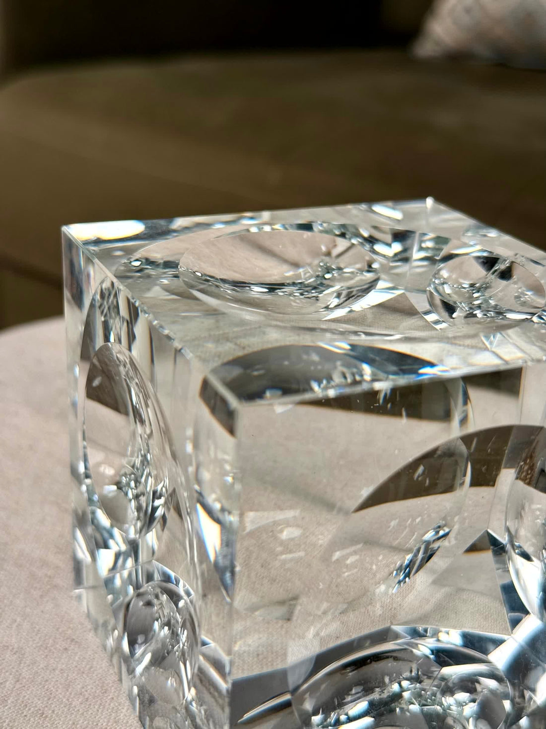 High Objects clear crystal cube artefact with polished edges reflecting light, perfect for modern décor.