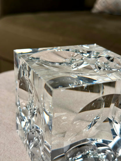 High Objects clear crystal cube artefact with polished edges reflecting light, perfect for modern décor.