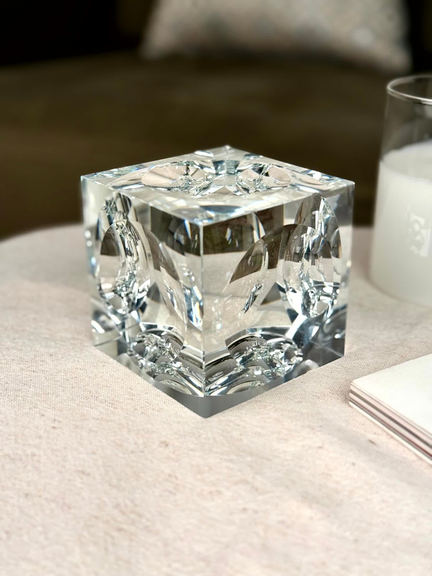 High Objects clear crystal cube artefact with sharp edges, reflecting light beautifully. Modern sculptural décor.