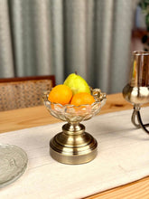 High Objects Crystal Droplet Accent Bowl, clear textured glass with metallic base, holding oranges and a pear.