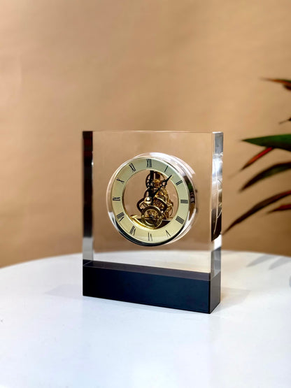 High Objects Crystal Block Gear Desk Clock with gold-tone exposed gears and Roman numerals on a black base.
