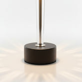 High Objects Crystal Halo Table Lamp with gold stem, black shade, and crystal accents, casting warm light.