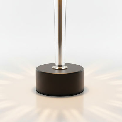 High Objects Crystal Halo Table Lamp with gold stem, black shade, and crystal accents, casting warm light.
