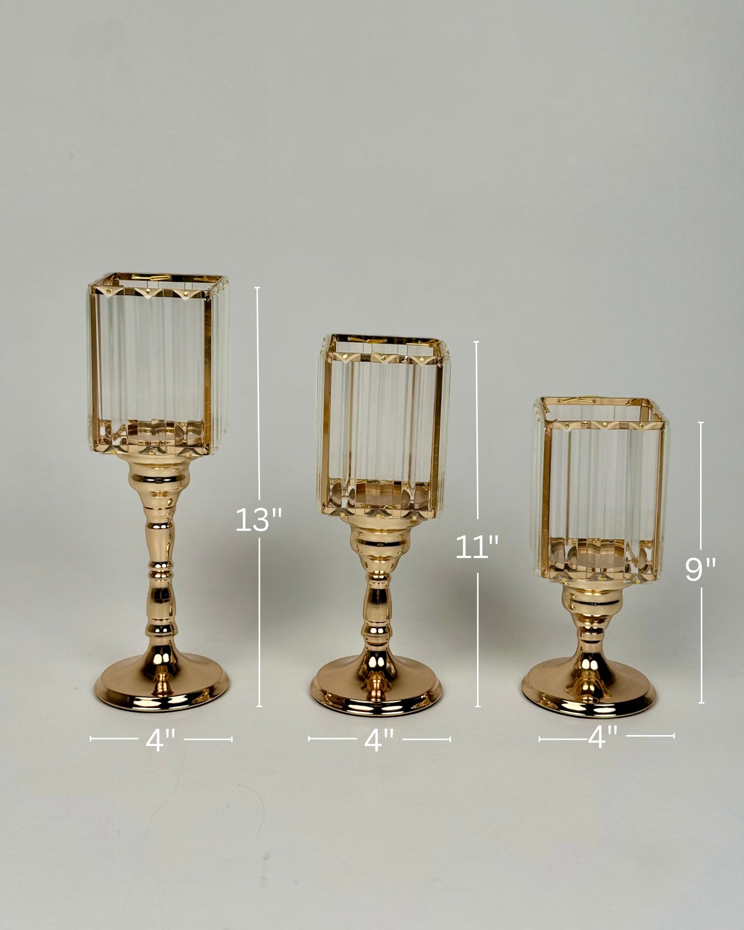 High Objects Crystal Luxe candle stand set with faceted glass hurricanes and gold pedestal bases. Set of 3 sizes: 13", 11", 9".