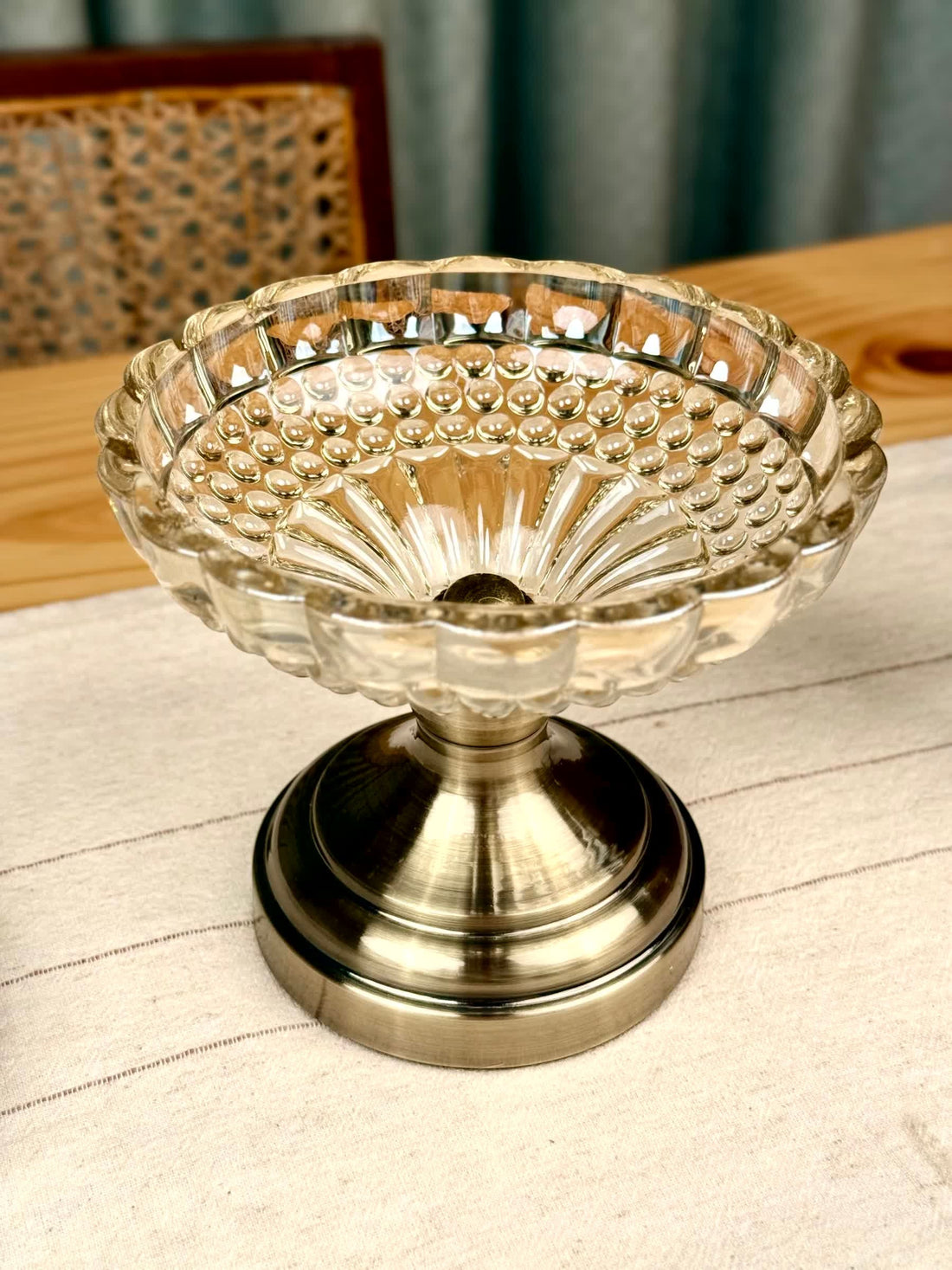 High Objects Crystal Charm Pedestal Bowl, clear textured glass with scalloped rim on a metallic base. Ideal for decor.