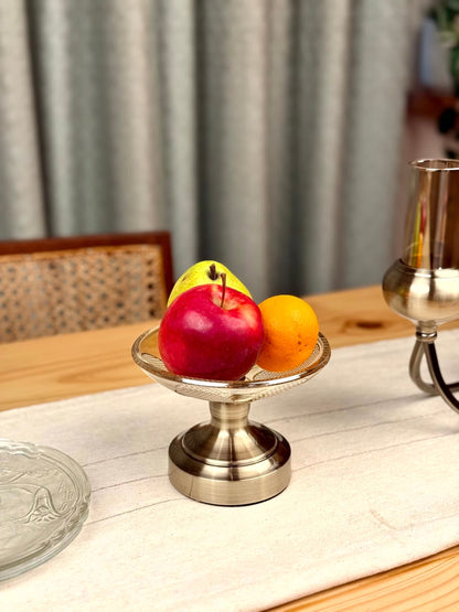 High Objects Crystal Petal Accent Platter with metallic base, holding apples and an orange.