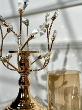 High Objects gold metal candle stand with crystal leaves and amber glass hurricane