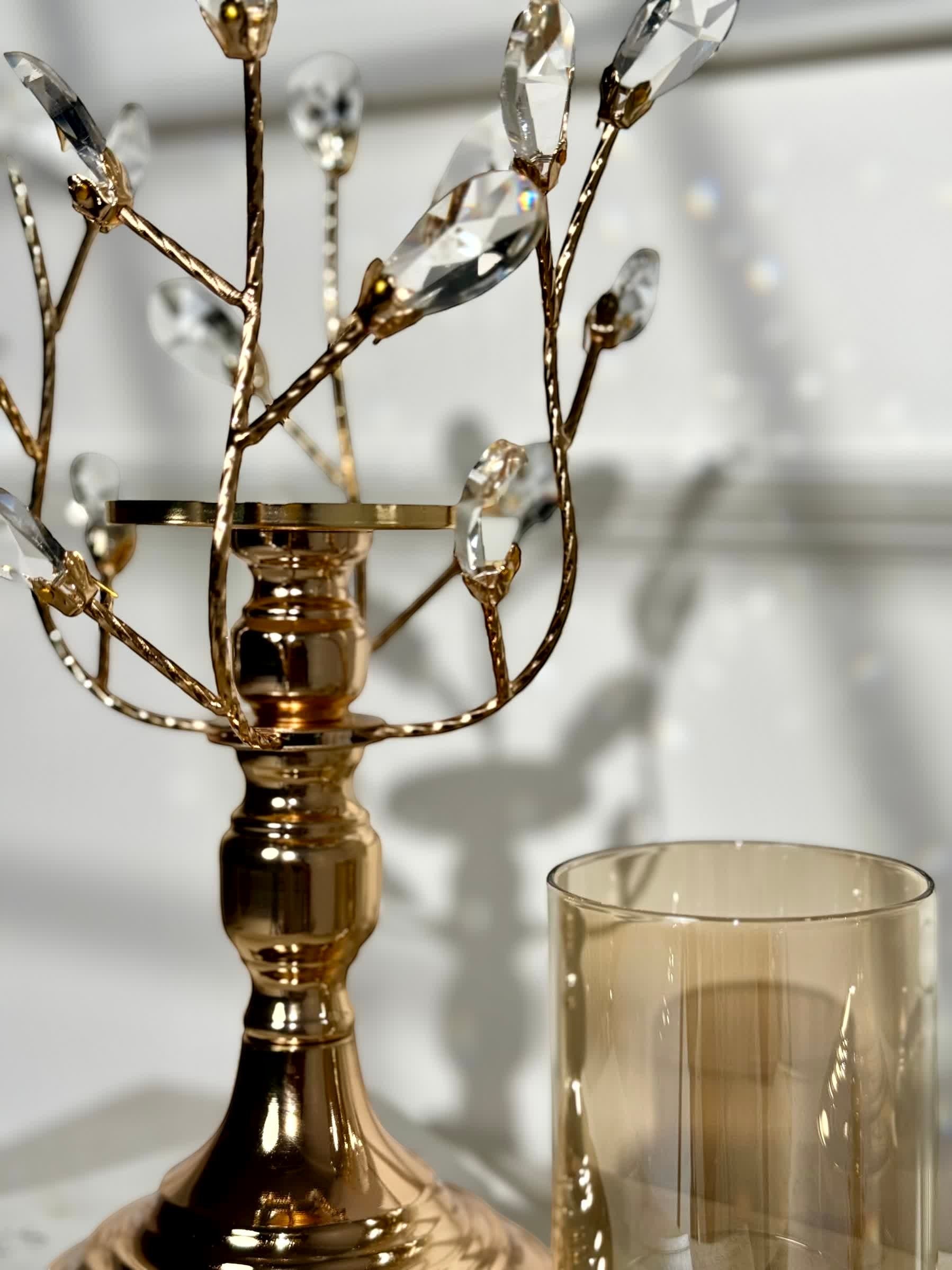 High Objects gold metal candle stand with crystal leaves and amber glass hurricane