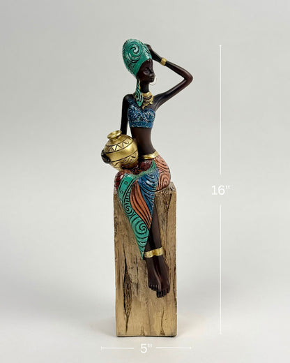 High Objects Desert Queen showpiece, 16-inch polyresin figurine of an African woman holding a gold pot, detailed attire with gold accents.