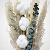 High Objects Maison Éclat dried botanical arrangement with cotton bolls, eucalyptus, grasses, and dried florals in a ceramic vessel.