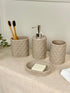 High Objects Dunecraft Bathroom Accessory Set, textured beige resin soap dish, dispenser, and two cups with toothbrushes.