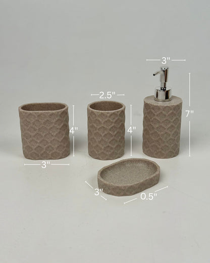 High Objects Dunecraft Bathroom Accessory Set in taupe textured resin, includes soap dispenser, toothbrush holder, cup, and soap dish.