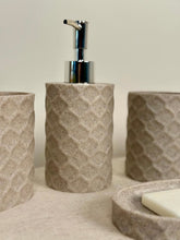 High Objects Dunecraft Bathroom Accessory Set in textured stone-like material with geometric pattern. Includes soap dispenser, cups, and soap dish.