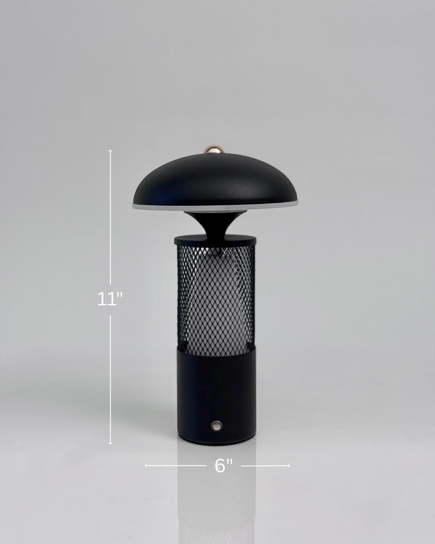 High Objects Eclipse Mesh Table Lamp in matte black with gold detailing, mushroom silhouette, textured mesh body, 11" H x 6" W.