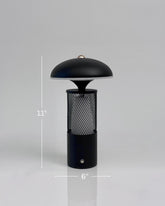 High Objects Eclipse Mesh Table Lamp in matte black with gold detailing, mushroom silhouette, textured mesh body, 11" H x 6" W.