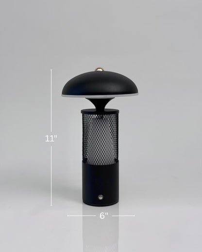 High Objects Eclipse Mesh Table Lamp in matte black with gold detailing, mushroom silhouette, textured mesh body, 11" H x 6" W.