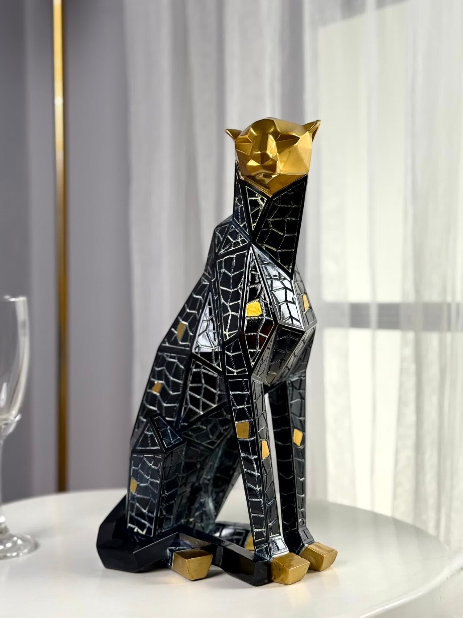 High Objects Eclipse Panther showpiece, abstract geometric polyresin sculpture in black with gold accents, modern decor.
