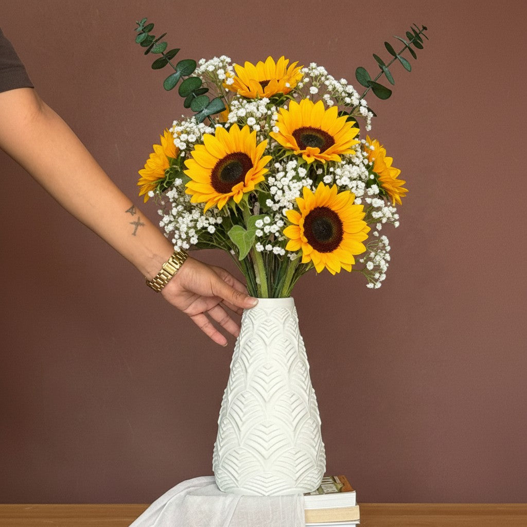 High Objects Elan Aura Vase with a stone-textured finish and sculptural silhouette, holding dried botanicals.