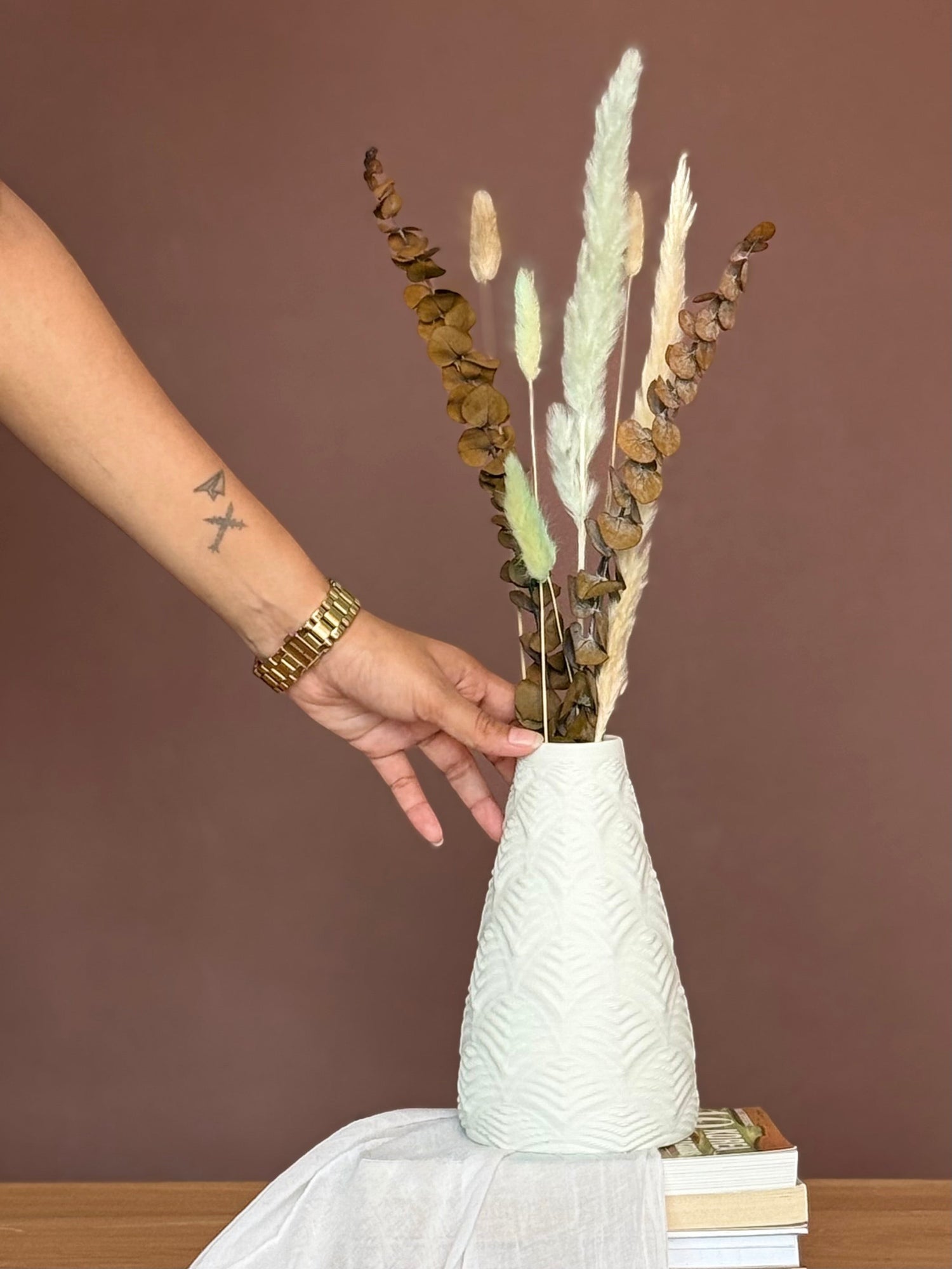 High Objects Elan Aura Vase, white textured ceramic vase with dried eucalyptus and pampas grass arrangement.