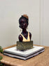 High Objects Elysian Grace Woman Showpiece bust with braided hair, flower, pearl earrings, and patterned base.