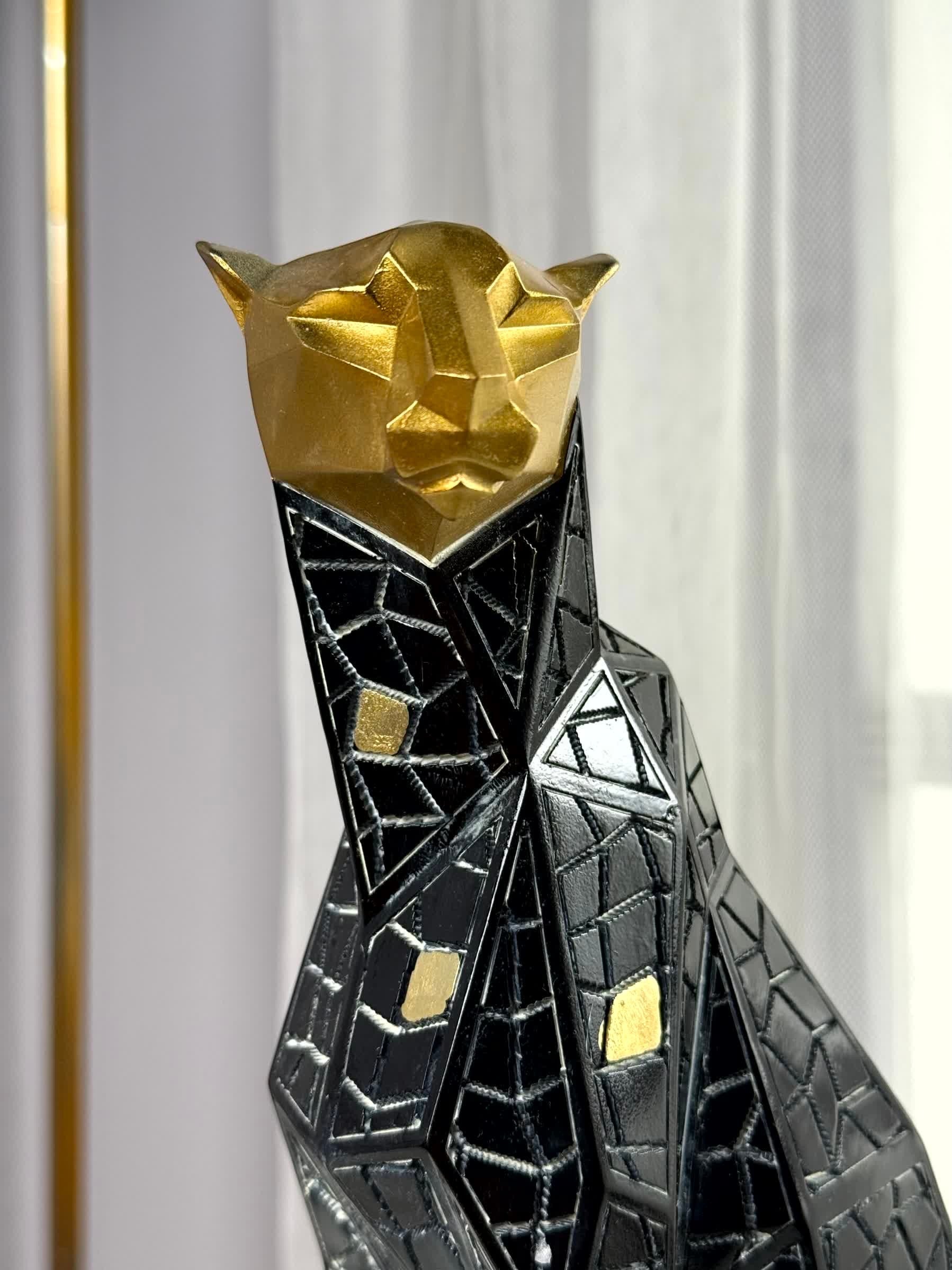 High Objects Geometric Panther showpiece, abstract black and gold polyresin sculpture with mosaic pattern.