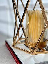 High Objects Gilded Prism Candle Stand with gold geometric frame and amber glass holder, modern decor