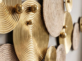 High Objects wall art featuring gold metal and natural rope circular plates in a modern textured design