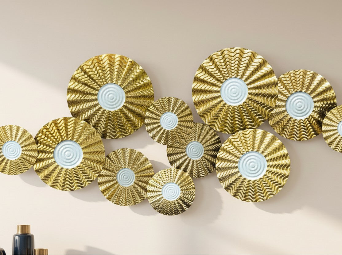 High Objects gold metallic wall art featuring a cluster of textured circular discs with white concentric centers.