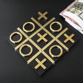 High Objects Gold Tic-Tac-Toe Table Décor Set with gold iron pieces and black MDF base. Modern luxury accent.