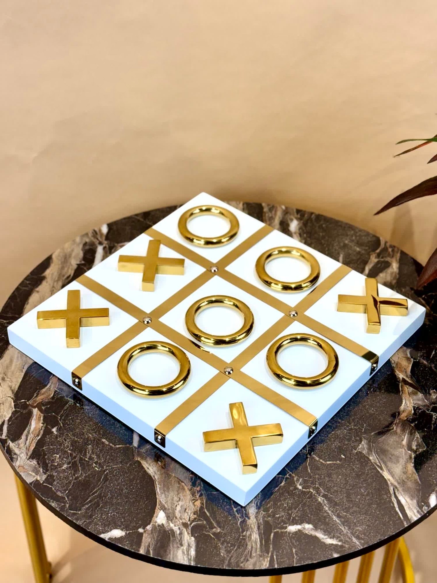High Objects Gold Tic-Tac-Toe Set with white base and gold-tone iron pieces. Modern luxury décor for tables and desks.