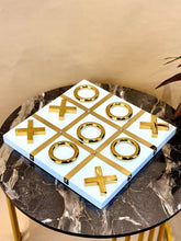 High Objects Gold Tic-Tac-Toe Set with white base and gold-tone iron pieces. Modern luxury décor for tables and desks.